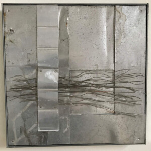 metal pieces mounted on wood