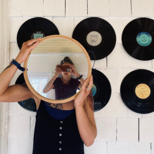 Woman reflected in mirror, artist: Angela Ramsey