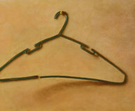 oil painting, clothes hanger on tan backgorund