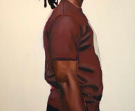 African American male wearing brown t-shirt