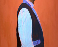 African American male wearing shirt and vest