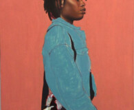 Young African American female wearing teal sweatshirt