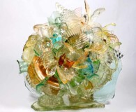 Old glass pieces shaped into an almost round ball.